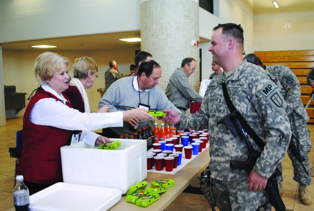 Apple Pie Brigade greets troops with smiles, pies