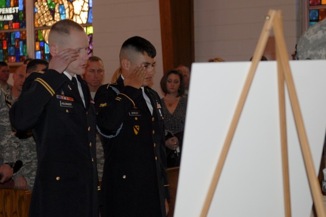 FORT HOOD, Texas - Chaplain (Capt.) Robert Holsinger (left), the chaplain for 3rd Battalion, 8th Cavalry Regiment, 3rd Brigade Combat Team, 1st Cavalry Division, and Spc. Keevon Shipley render honors to Spc. Ian Borelli at his memorial service on...