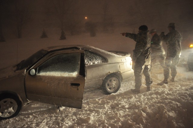 Guard members help stranded motorists