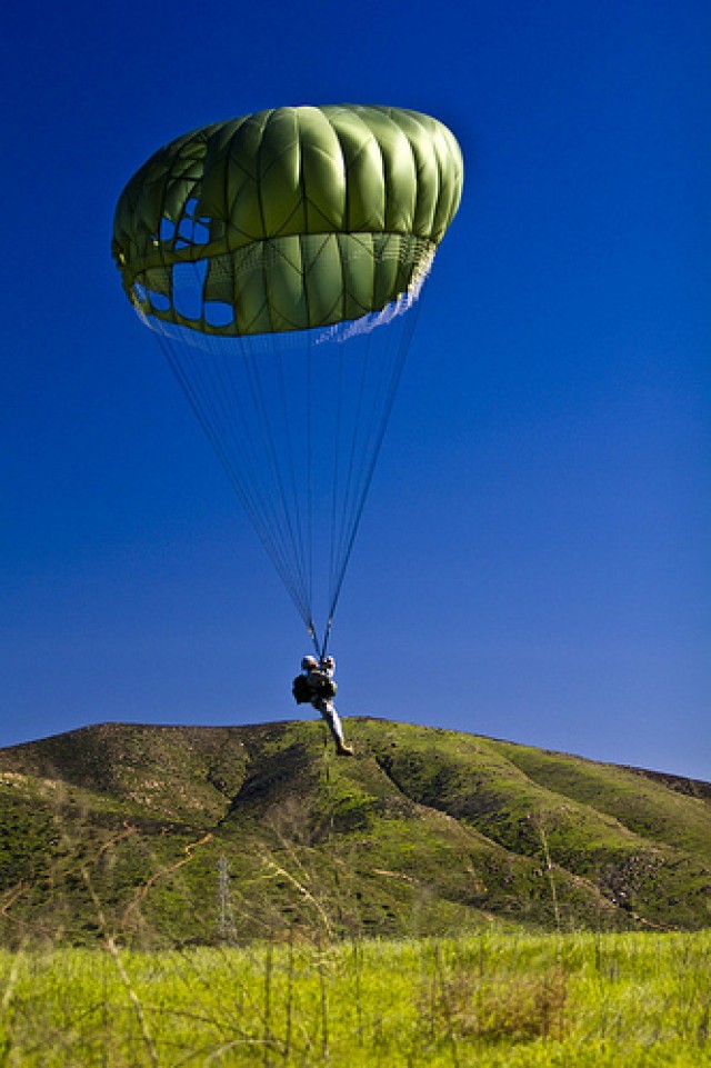 Paratroopers from the 301st Tactical PSYOP Co. finish up Battle Assembly with a second Airborne Operation onto Trident Drop Zone just a few hundred yards from the U.S.-Mexican boarder in San Diego, CA on January 23, 2011. The 301st TPC left San...