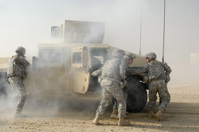 CAMP BEUHRING, Kuwait - Soldiers with personal security detachment, Headquarters and Headquarters Troop, 3rd Advise and Assist Brigade, 1st Cavalry Division react to a downed vehicle and hostile contact during a training event Feb. 8 at Camp...