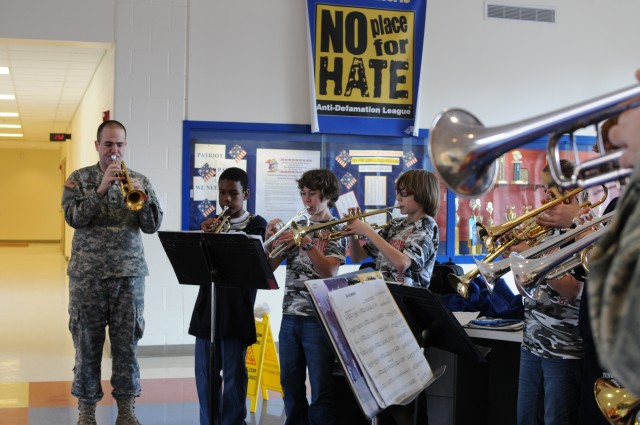 FORSCOM band coaches students while performing its community outreach mission
