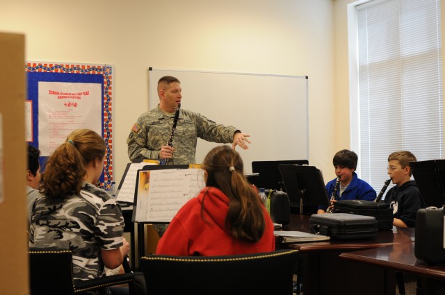 FORSCOM band coaches students while performing its community outreach mission