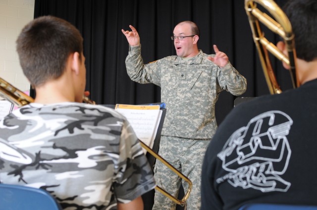 FORSCOM band coaches students while performing its community outreach mission