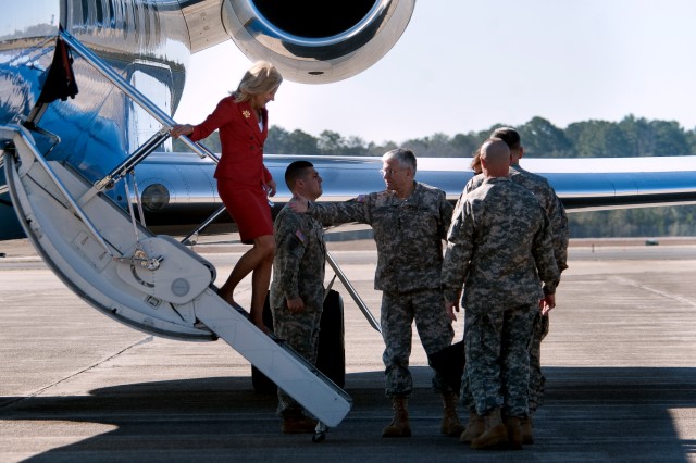 Chief of Staff of the Army, Gen. George W. Casey Jr., helps Dr. Jill Biden, wife of Vice President Joe Biden, off a plane as they arrive at Hunter Army Airfield, Georgia, Feb. 14, 2011.  Dr. Biden's visit is part of the administration's ongoing...