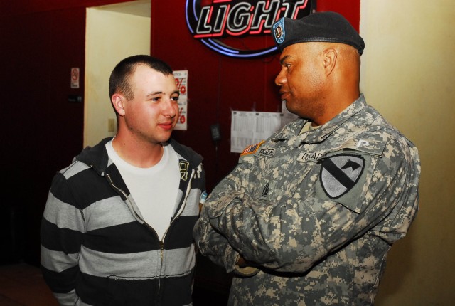 FORT HOOD, Texas - 1st Sgt. Walter Rogers (right), a Lawton, Ok., native and the first sergeant for C Company, 2nd Special Troops Battalion, 2nd Brigade Combat Team, 1st Cavalry Division, talks with Spc. David Lemar, a Soldier with 1st Brigade Combat...