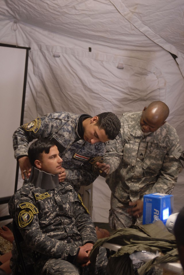 CONTINGENCY OPERATING SITE MAREZ, Iraq-Sgt. Kwame Hart (right), a combat medic section chief assigned to Headquarters and Headquarters Battery, 5th Battalion, 82nd Field Artillery Regiment, 4th Advise and Assist Brigade, 1st Cavalry Division,...