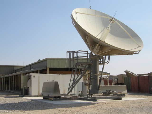 PM WIN-T employee ensures SATCOM equipment is up and running