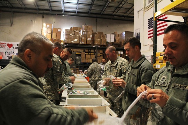 FORT HOOD, Texas-Soldiers from the 1st Air Cavalry Brigade, 1st Cavalry Division, make care packages for deployed Soldiers at the Soldiers' Angels headquarters in San Antonio, Feb. 10. Soldiers' Angels is a non-profit, volunteer- led organization...