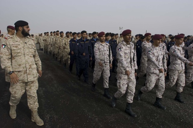 Coalition Soldiers participate in 50/20 Celebration rehearsals