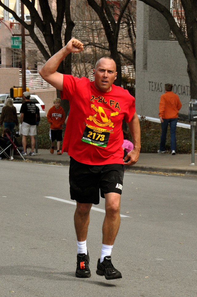 AUSTIN, Texas-Staff Sgt. Danny Bishop, with Battery C, 2nd Battalion, 20th Field Artillery Regiment, shows his heart at the 600 meter mark during the Live Strong Austin Marathon held Feb. 20. Bishop completed one of the nation's biggest marathons...