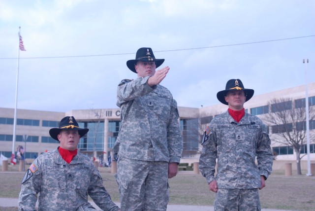FORT HOOD, Texas - 1st Lt. Joshua Herzog (center), a platoon leader assigned to Battery B, 1st Battalion, 82nd Field Artillery Regiment, 1st Brigade Combat Team, 1st Cavalry Division, gives the command to fire at the farewell ceremony for outgoing Br...