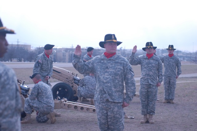 FORT HOOD, Texas -Section chiefs assigned to the Battery B, 1st Battalion, 82nd Field Artillery Regiment, 1st Brigade Combat Team, 1st Cavalry Division, stand ready to fire an Artillery Salute during the Farewell Ceremony for outgoing Brig. Gen. John...
