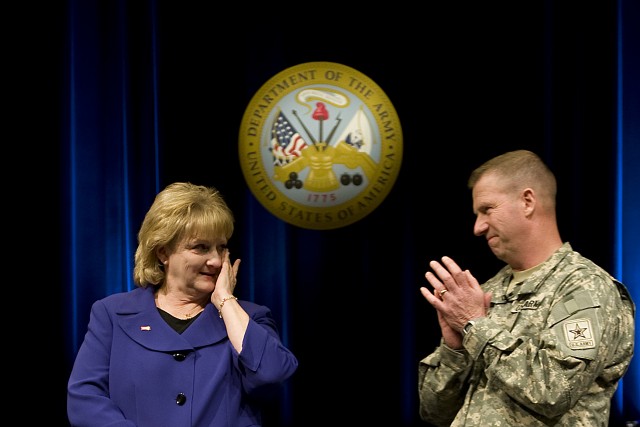 Sgt. Maj. of the Army Kenneth O. Preston leads an applause for his wife, Karen, during an event held in honor of the Prestons service at the Pentagon in Washington DC on Feb. 25, 2011.  Preston has served as the Army's top enlisted adviser for...