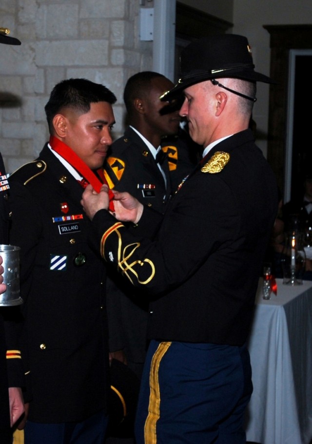 BELTON, Texas - Lt. Col. Nate Cook (right), commander of the 3rd Battalion, 82nd Field Artillery Regiment, 2nd Brigade Combat Team, 1st Cavalry Division, awards Sgt. 1st Class Anthony Sollano, a platoon sergeant with A Battery, 3rd Bn., 82nd FA...