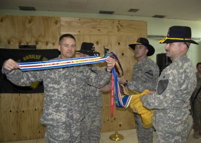 JOINT SECURITY STATION INDIA, Iraq - Maj. Gen. Daniel Allyn, commanding general of 1st Cavalry Division, displays the streamer for a Valorous Unit Award presented to 2nd Battalion, 7th Cavalry Regiment, 4th Advise and Assist Brigade, 1st Cav. Div., d...