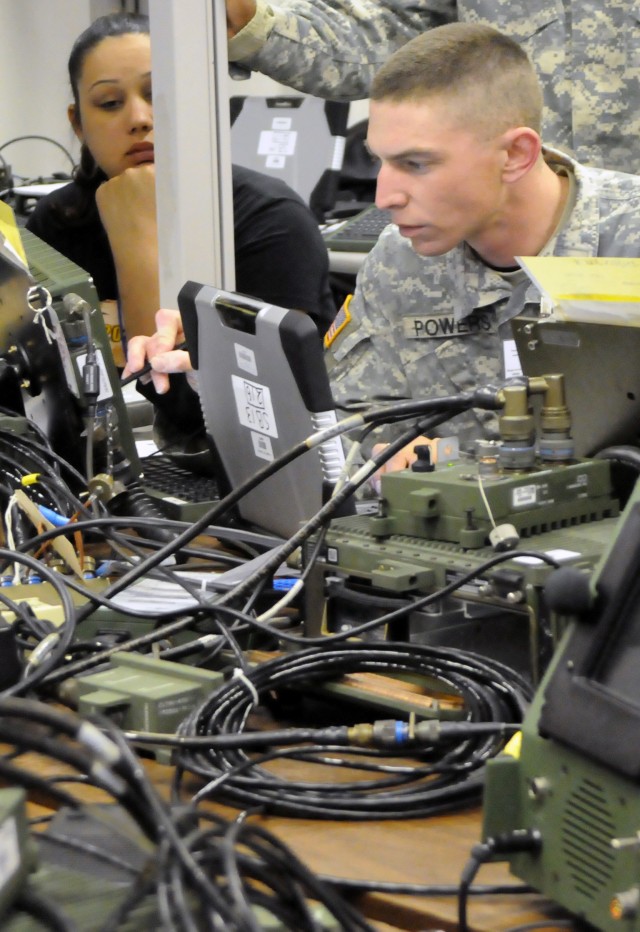 US Army Specialist checks data accuracy during FBCB2 Field Test