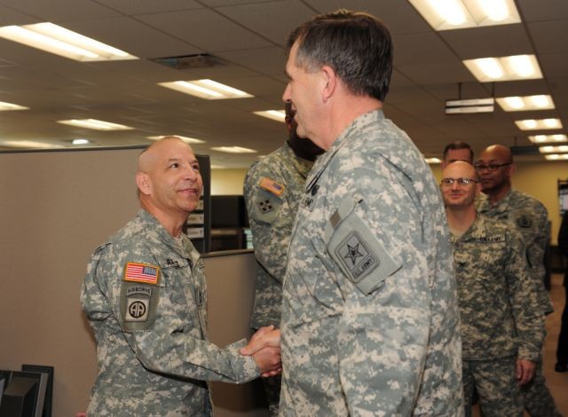 Casualty and Mortuary Affairs Operations Center NCO receives coin from vice chief of staff, Army