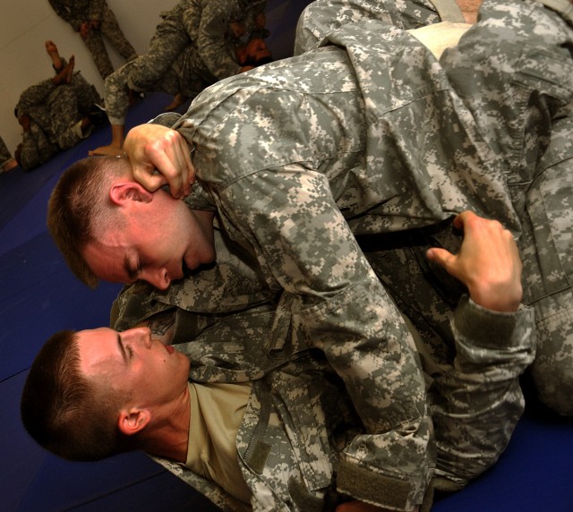 FORT HOOD, Texas-Cpl. Richard Lee (top) with Headquarters and Headquarters Battery, 2nd Battalion, 20th Field Artillery Regiment, spars with Pvt. Gabriel Vanessendelft, with Btry. A, 2nd Bat., 20th FA Regt., during Deep Strike's level two combatives ...