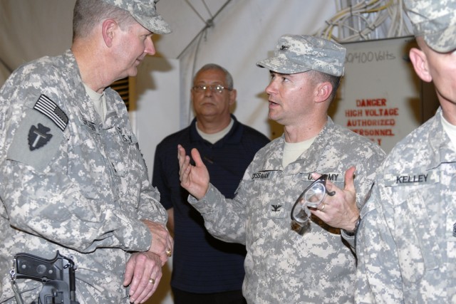 CONTINGENCY OPERATING BASE ADDER, Iraq - Col. Douglas Crissman, commander of 3rd Advise and Assist Brigade, 1st Cavalry Division chats with Maj. Gen. Eddy Spurgin, commander of 36th Infantry Division and United States Division - South. The Greywolf B...