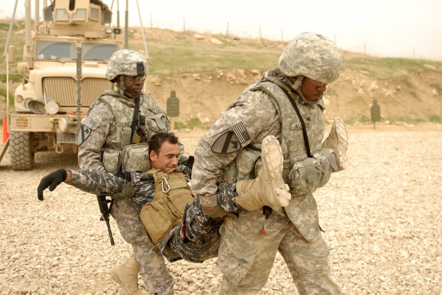 CONTINGENCY OPERATING SITE MAREZ, Iraq - Pfc. Luther Alston (right) and Spc. Oriola Owokoya (left), both medics assigned to Headquarters and Headquarters Battery, 5th Battalion, 82nd Field Artillery Regiment, 4th Advise and Assist Brigade, 1st...