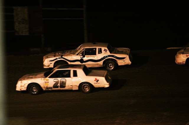 KILLEEN, Texas- Vernon 'Buck' Owens, a native of Cedar Park, Texas, and a retired Chief Warrant Officer, speeds past car number 29 during his feature stock car race opening night at Texas Thunder Speedway, March12. Owens placed 10 out of 18...