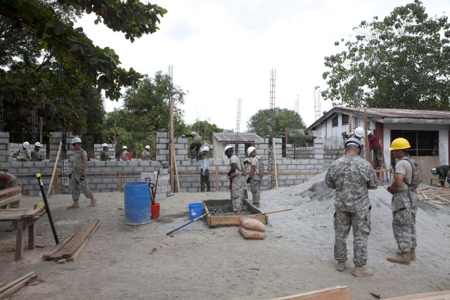 Engineer Company build walls for elementary school classrooms