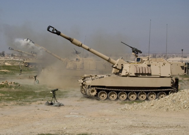 CONTINGENCY OPERATING SITE MAREZ, Iraq - "Black Dragons," 5th Battalion, 82nd Field Artillery Regiment, 4th Advise and Assist Brigade, 1st Cavalry Division, fire M109A6 Paladins during a certification exercise, March 16, 2011. The "Red Leg" Soldiers ...