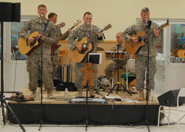 CONTINGENCY OPERATING SITE MAREZ, Iraq - Musicians of 4th Infantry Division rock band "H.E.A.T.," perform for Soldiers assigned to 4th Advise and Assist Brigade, 1st Cavalry Division at Contingency Operating Site Marez Memorial Dining Facility, March...