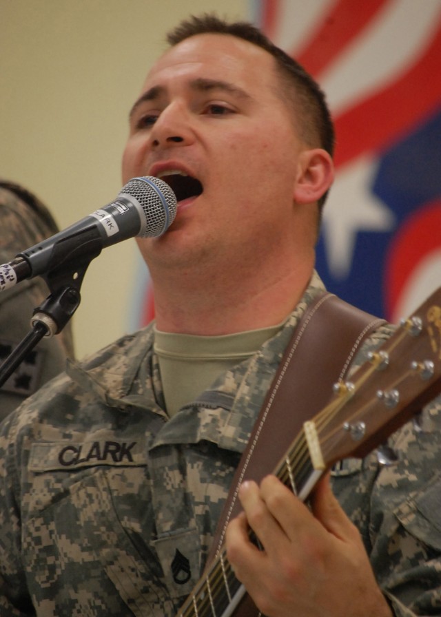 CONTINGENCY OPERATING SITE MAREZ, Iraq - Staff Sgt. Phil Clark, a guitar player and vocalist of the 4th Infantry Division rock band "H.E.A.T.," performs for Soldiers assigned to 4th Advise and Assist Brigade, 1st Cavalry Division at Contingency Opera...
