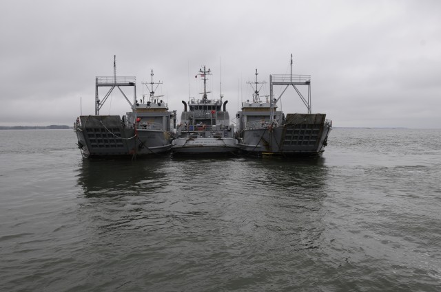 'Tow the Line' Soldiers depart Yorktown Coast Guard station, Yorktown, Va. at 10:30 a.m. March 24 on board the Large Tug-805 with two Landing Craft Utility vessels in tow. The crew of 25 Army sailors is assigned to the 73rd Transportation Company, 10...