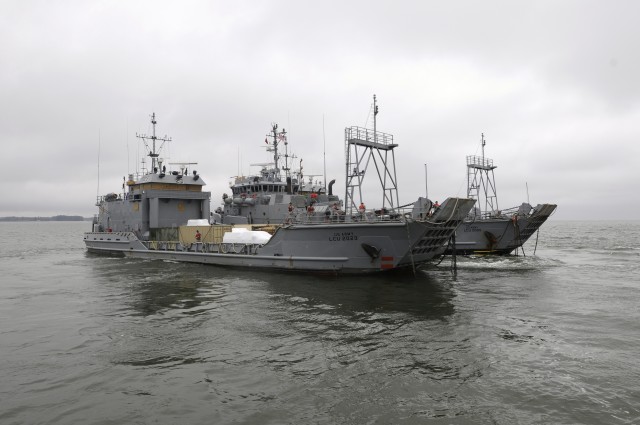 'Tow the Line' Soldiers depart Yorktown Coast Guard station, Yorktown, Va. at 10:30 a.m. March 24 on board the Large Tug-805 with two Landing Craft Utility vessels in tow. The crew of 25 Army sailors is assigned to the 73rd Transportation Company,...