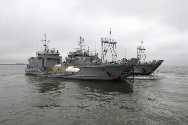 'Tow the Line' Soldiers depart Yorktown Coast Guard station, Yorktown, Va. at 10:30 a.m. March 24 on board the Large Tug-805 with two Landing Craft Utility vessels in tow. The crew of 25 Army sailors is assigned to the 73rd Transportation Company, 10...