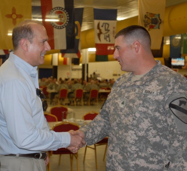CONTINGENCY OPERATING BASE BASRAH, Iraq - Sgt Philip McKee, a tanker in A Company, 1st Battalion, 12th Cavalry Regiment, 3rd Advise and Assist Brigade, 1st Cavalry Division, of Doylestown, Pa., is greeted by Rep. Thomas Marino, R-Pa. before a...