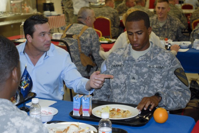 CONTINGENCY OPERATING BASE BASRAH, Iraq - Sgt Charlito Chumney (right), a combat engineer in Headquarters and Headquarters Company, 1st Battalion, 12th Cavalry Regiment,  3rd Advise and Assist Brigade, 1st Cavalry Division, of Harlem, N.Y.,...