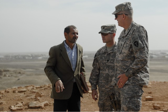 CONTINGENCY OPERATING BASE ADDER, Iraq - Maj. Gen. Eddy Spurgin (right), the commander of the 36th Infantry Division and United States Division - South, and Lt. Col. Robert Wright, commander of 2nd Battalion, 82nd Field Artillery Regiment, 3rd Advise...