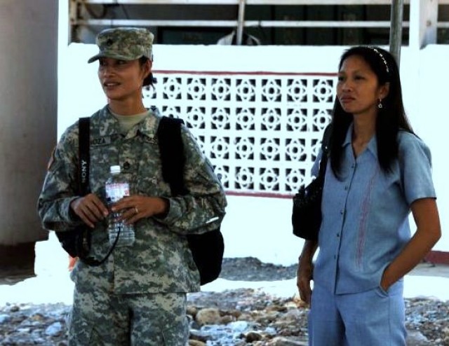 Army Staff Sgt. Marie Lanoza, observes the official groundbreaking ceremony