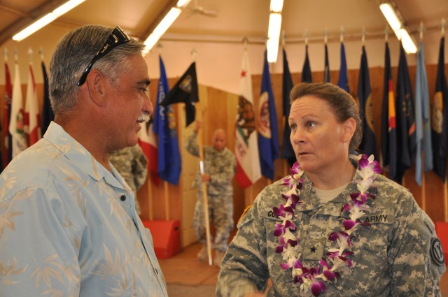 SCHOFIELD BARRACKS, Hawaii - Brig. Gen. Michele Compton, commanding general, 9th Mission Support Command, speaks with the father of deploying Soldier, Sgt. Kiana Vincent, chaplain assistant, 124th Chaplain Detachment, at a deployment ceremony here, A...