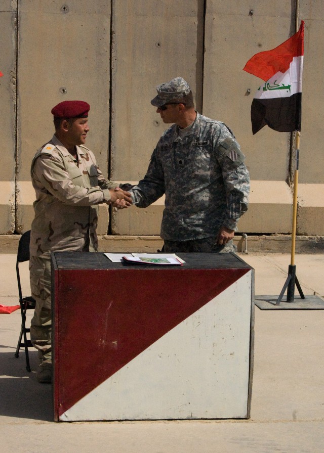 CONTINGENCY OPERATING SITE MAREZ, Iraq - Maj. Mohammad, executive officer of 1st Battalion, 9th Brigade, 3rd Iraqi Army Division, expresses his gratitude to Lt. Col. Robert Reynolds, commander, 6th Squadron, 8th Cavalry Regiment, 4th Advise and Assis...