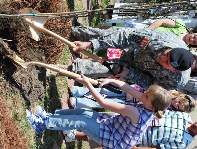 Fort Bragg children plant an Arbor Day seed