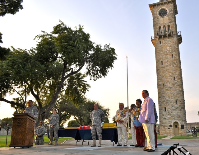 Fiesta royalty and military commanders exchange gifts of goodwill