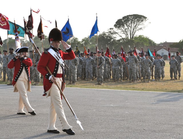 The Fife and Drum Corps demonstrates marching music as Joint Base San Antonio Soldiers look on