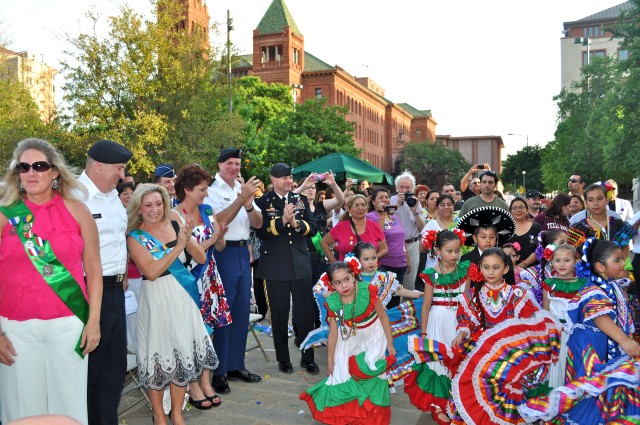 Lt. Gen. Rick Lynch, his wife Mrs. Sarah Lynch, Command Sgt. Maj. Neil Ciotola, his wife Mrs. Beth Ciotola and Maj. Gen. Perry Wiggins watch as flamenco dancers kick up their heels