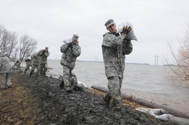 carrying sandbags in rain