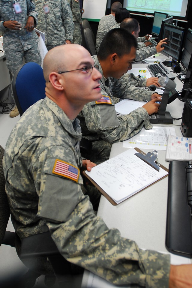 FORT RUCKER, Ala. - Pfc. Dave Caruana, a native of Apache Junction, Ariz., a radio/telephone operator for the Headquarters Company of the 1st Air Cavalry Brigade, 1st Cavalry Division, tracks events as they happen during an aviation training...