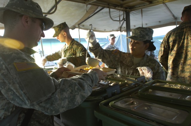 Joint force feed troops at Fort Magaysay