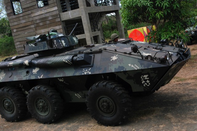 Filipino service member drives LAV-25 used by the US Marines