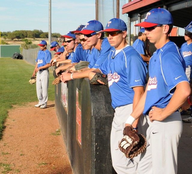 HARKER HEIGHTS, Texas- Members of the Temple "Wildcats" High School varsity baseball team stand together awaiting their turn to warm-up before their game against the Harker Heights "Knights" at the Harker Heights High School April 12.  The two teams ...