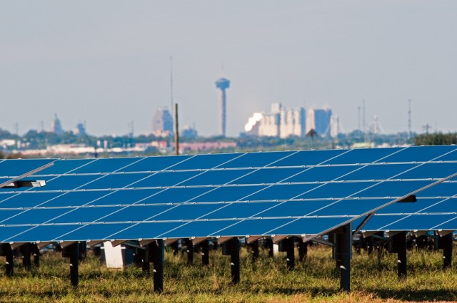 The Blue Wing Solar Project&#039;s photovoltaic panels stand out against the San Antonio skyline. Photo courtesy of Duke Energy.