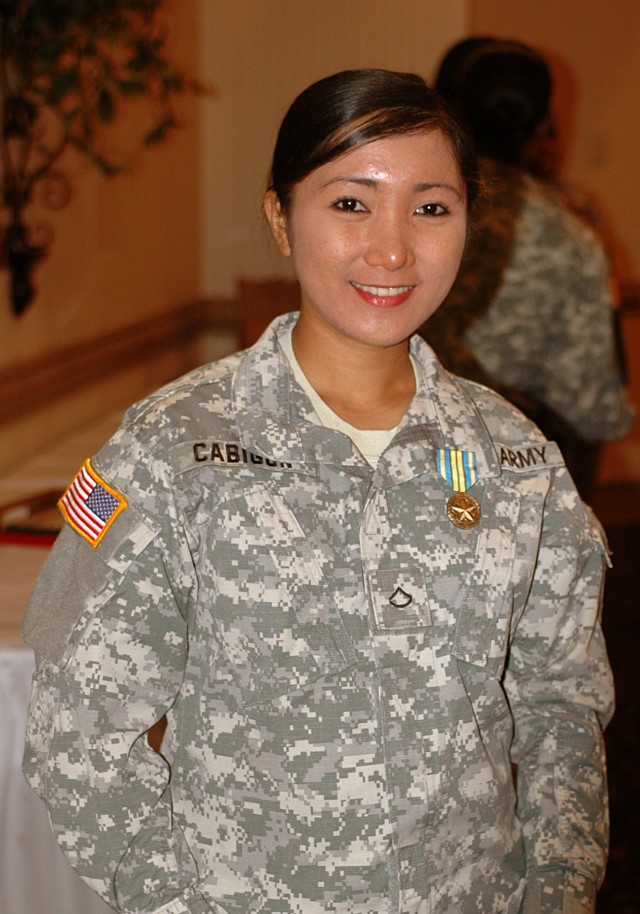FORT HOOD, Texas-Pfc. Lyka Cabigon, a Manila, Philippines native with 67th Forward Support Company, 2nd Battalion, 20th Field Artillery Regiment, 41st Fires Brigade, received the Military Outstanding Volunteer Service medal for volunteering her...